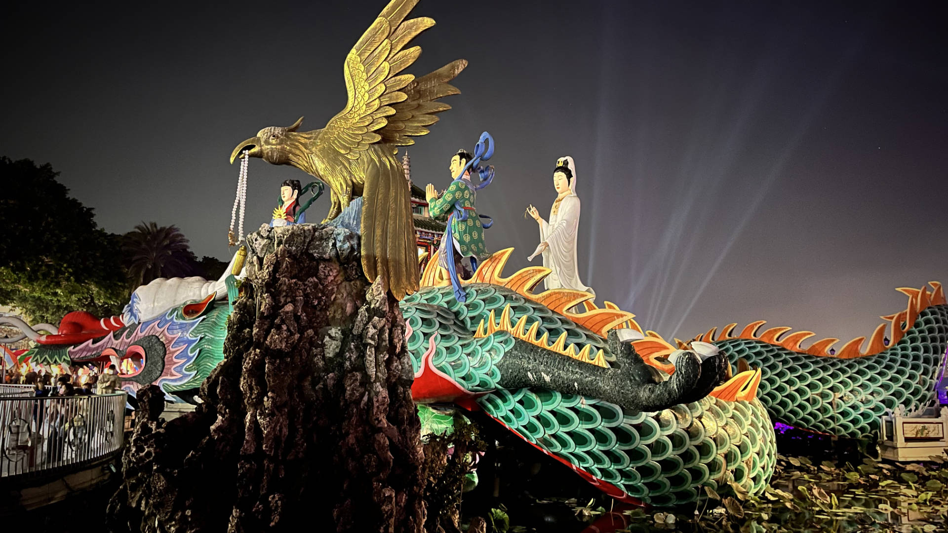Colorful statue of Guanyin riding a dragon at Lotus Pond.