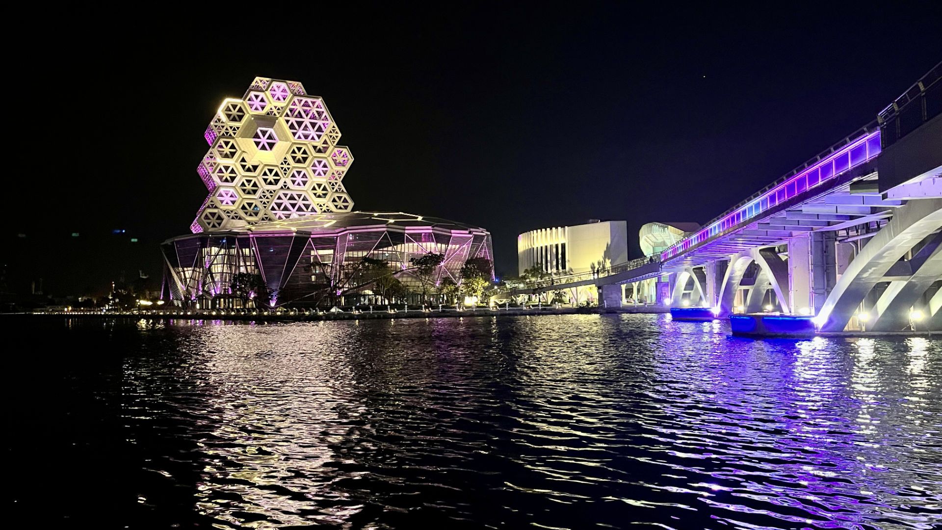 Kaohsiung Music Center at night, from across the mouth of Love River.