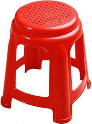 A short, red plastic stool.