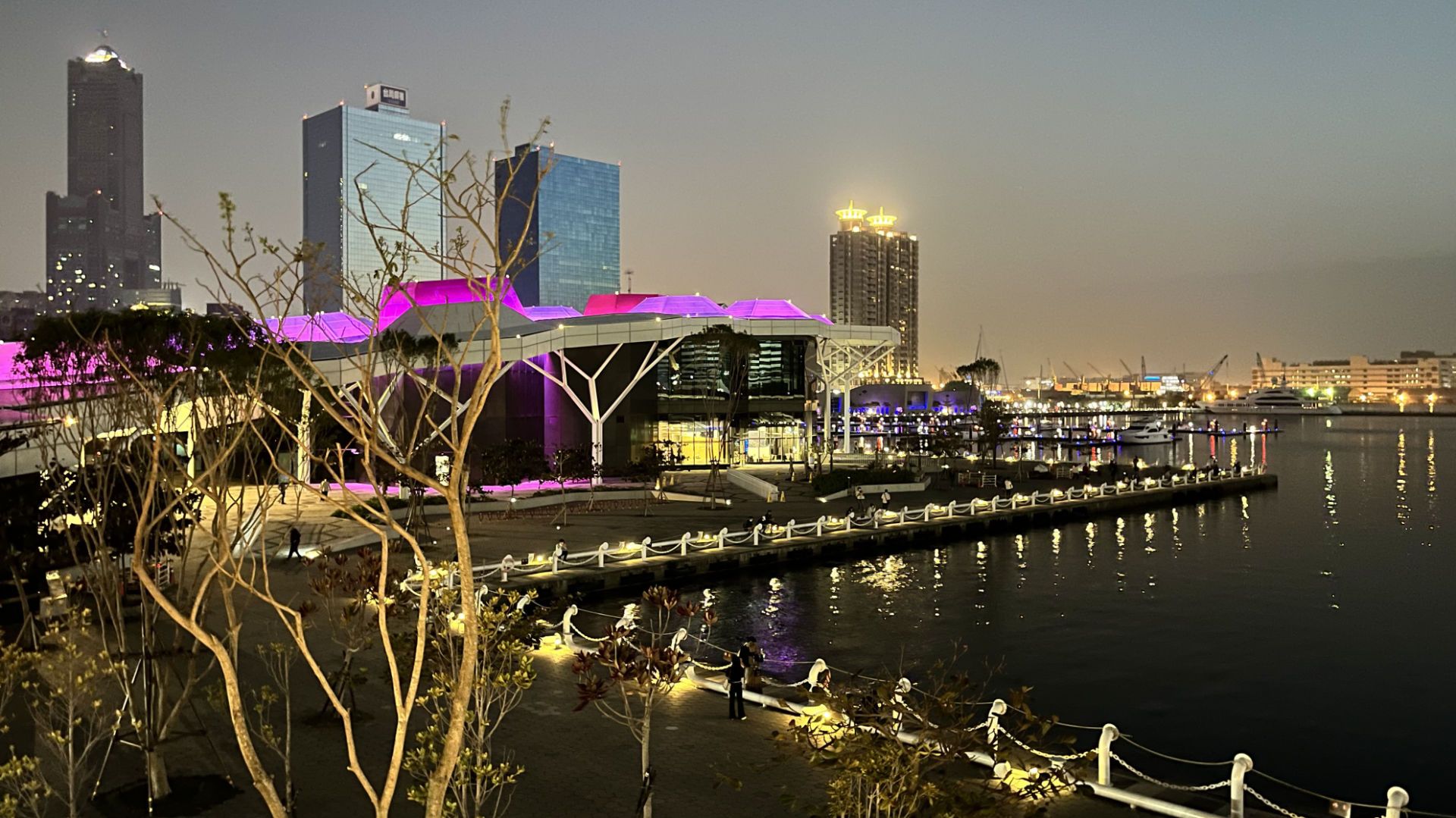 View across the mouth of Love River, with Argo Yacht Club in front of distant skyscrapers.