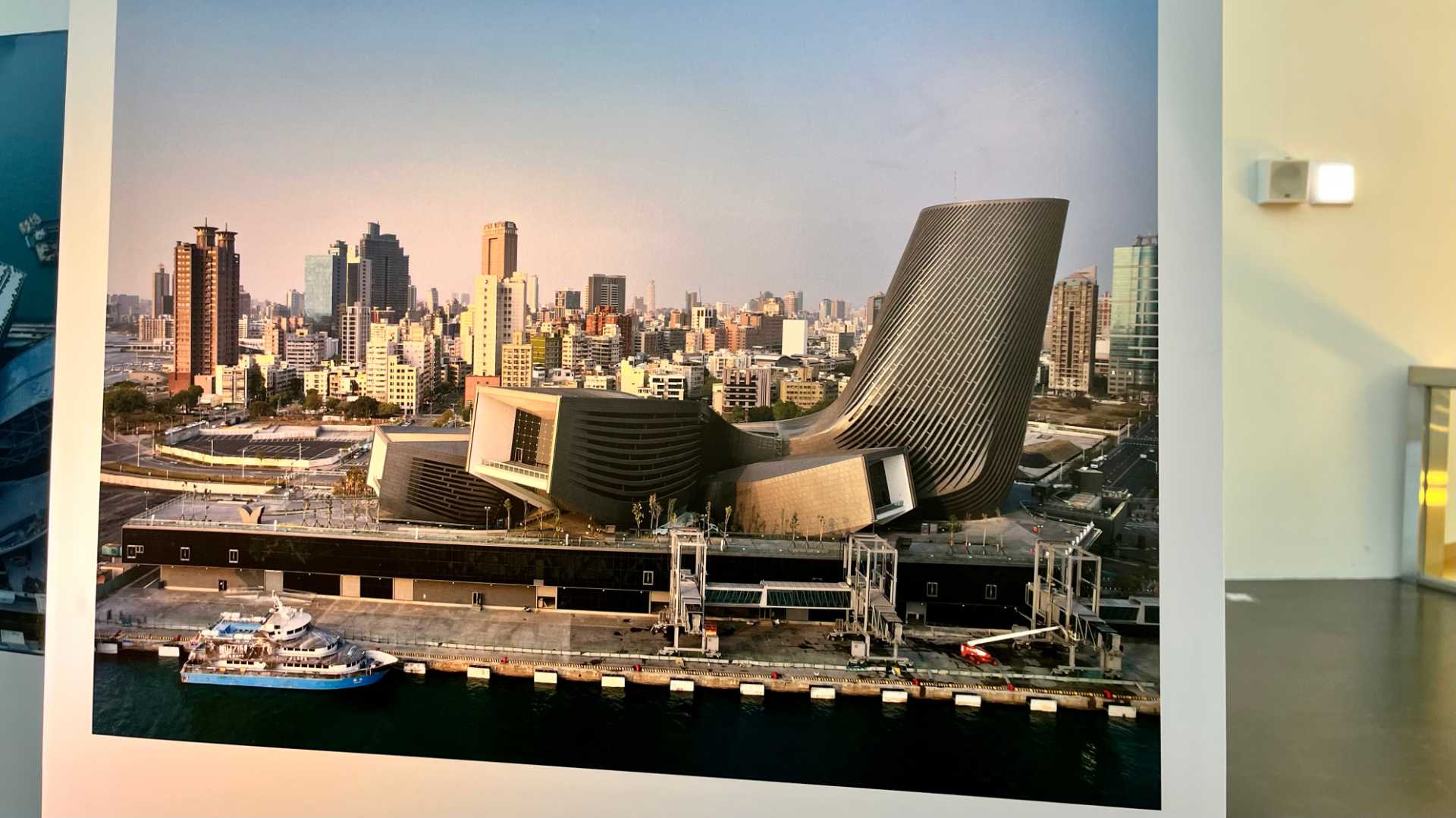 Printed aerial photo of the seaward side of the Kaohsiung Port Cruise Terminal. The building looks completed, although there is still a mobile crane visible in the foreground.