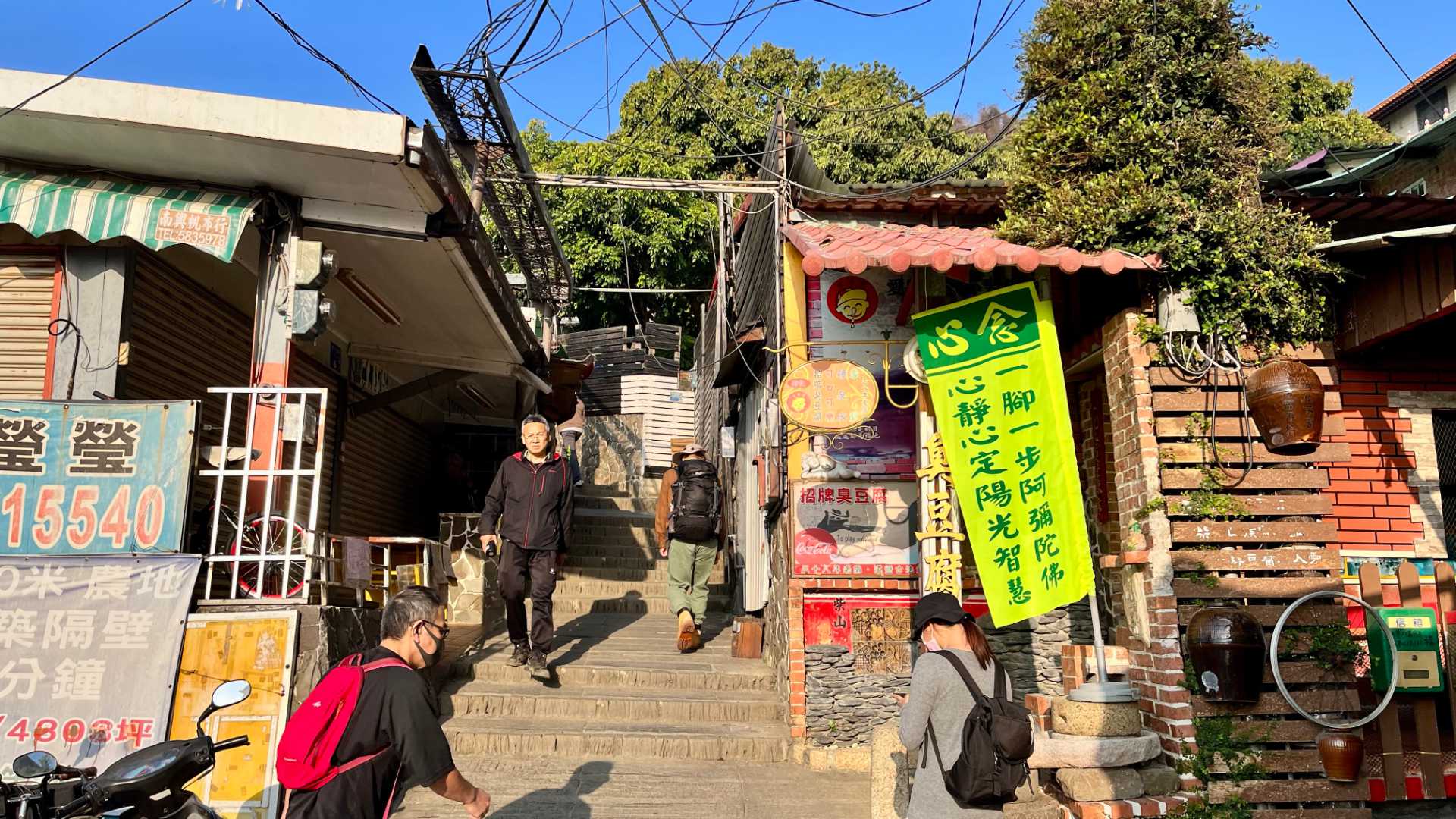 The first few steps up Monkey Mountain; a narrow staircase between small shops.