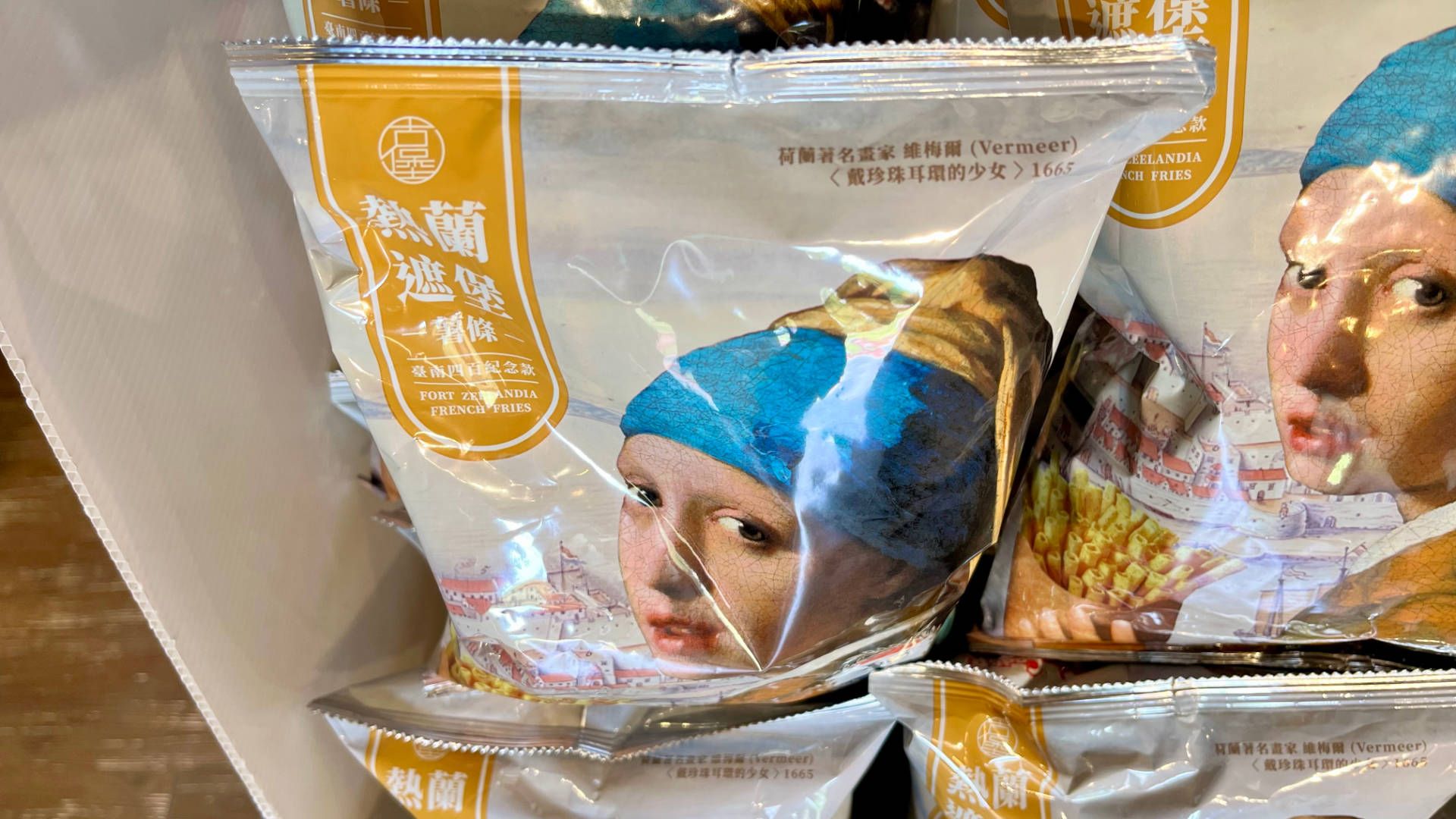 Bags of Fort Zealandia French Fries, with Johannes Vermeer’s ‘Girl with a Pearl Earring’ panting on the packaging.