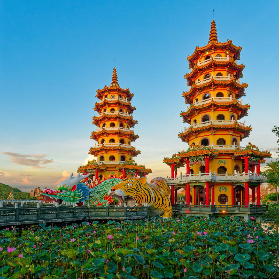 The Dragon and Tiger Pagodas on Lotus Pond, Kaohsiung, Taiwan. This photo was taken at sunset while the lotuses were flowering.