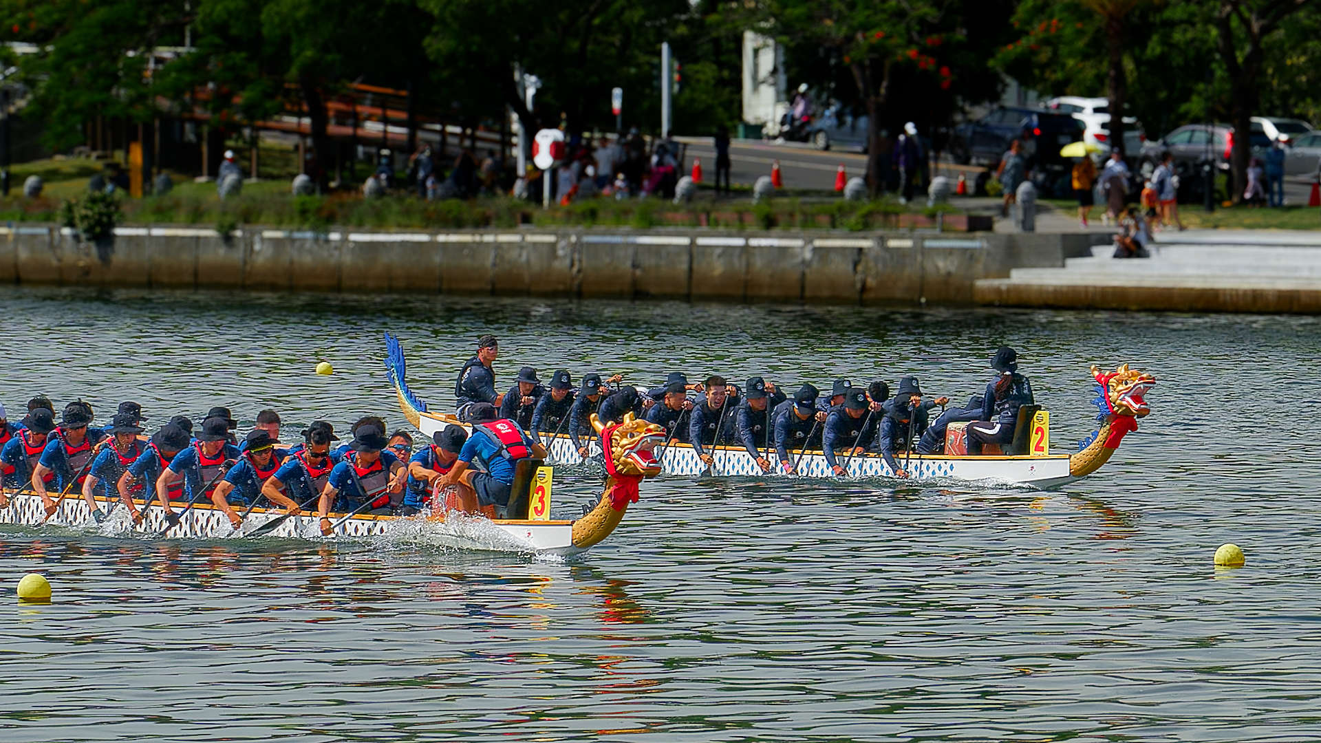 Two teams in a dragon boat race on Love River, Kaohsiung.