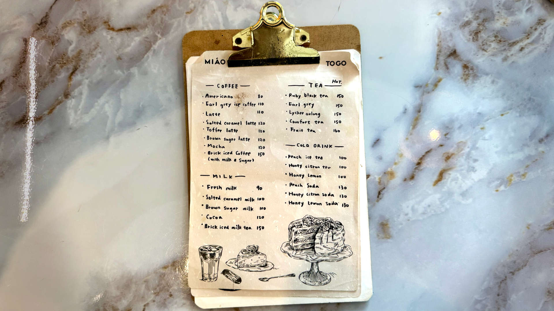 A hand-written menu in English. The front page has four categories: coffee, milk, tea, and cold drink.