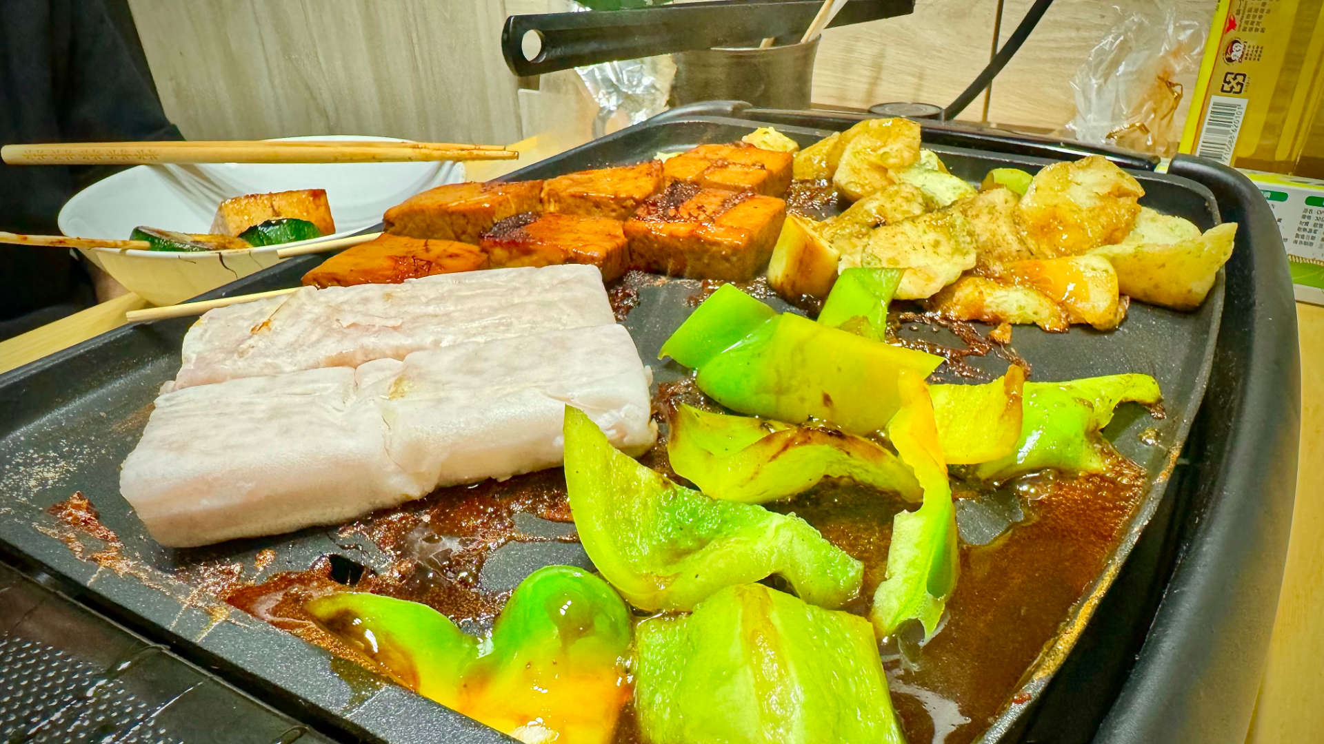 Close-up of vegetables on an indoor grill.