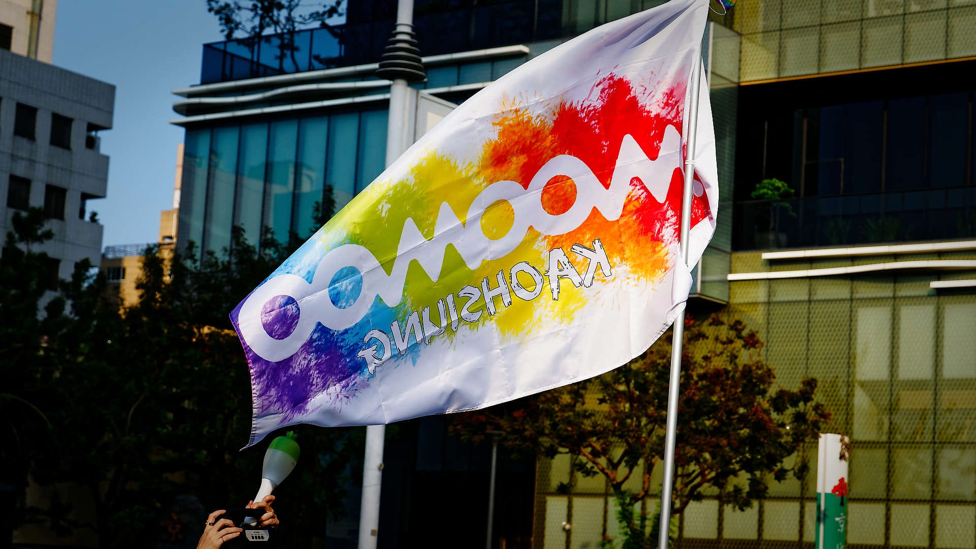 Rainbow-colored flag with the words “Moomoo Kaohsiung”.