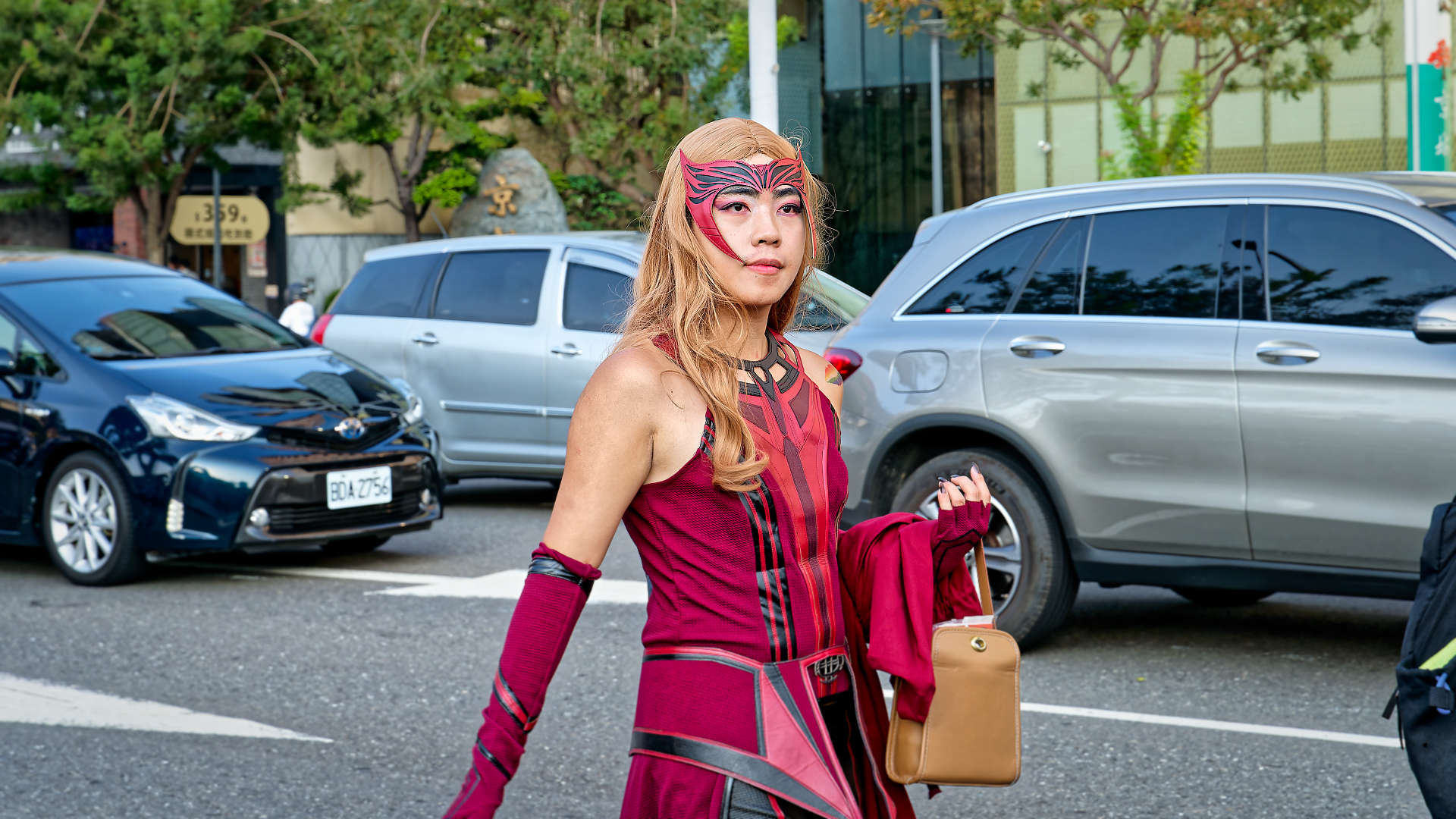 Person in costume walking at the Kaohsiung Pride parade.