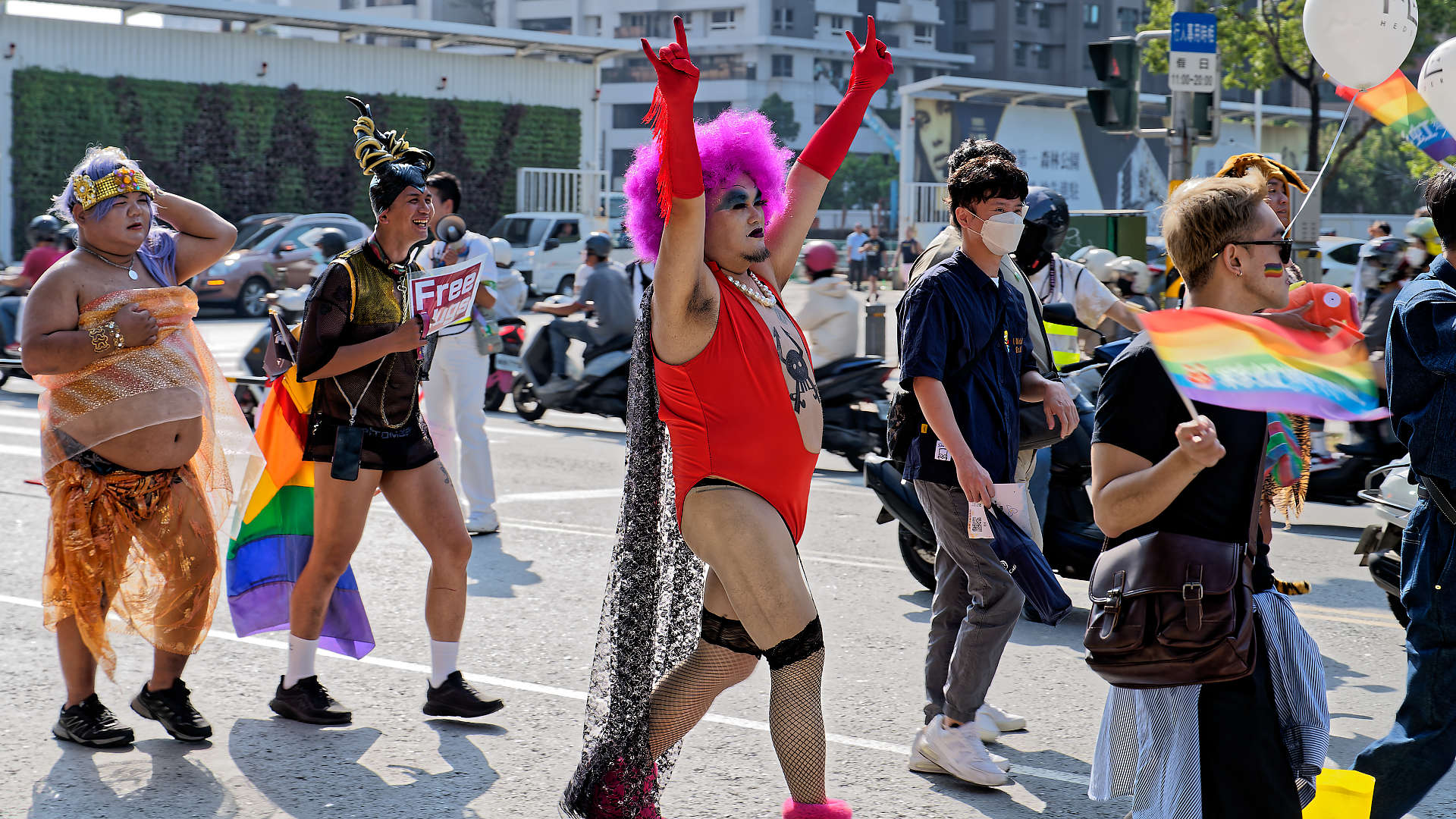 People in costumes in the Kaohsiung Pride parade.