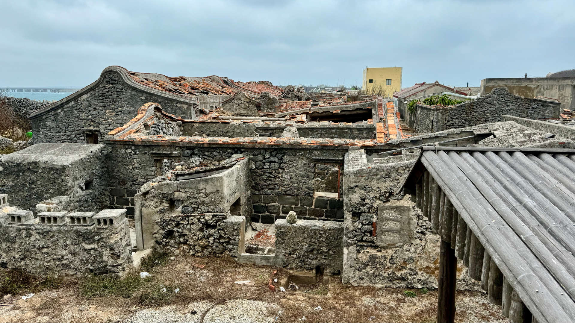 Abandoned village on Xiyu Island. The buildings are constructed of stone and coral.