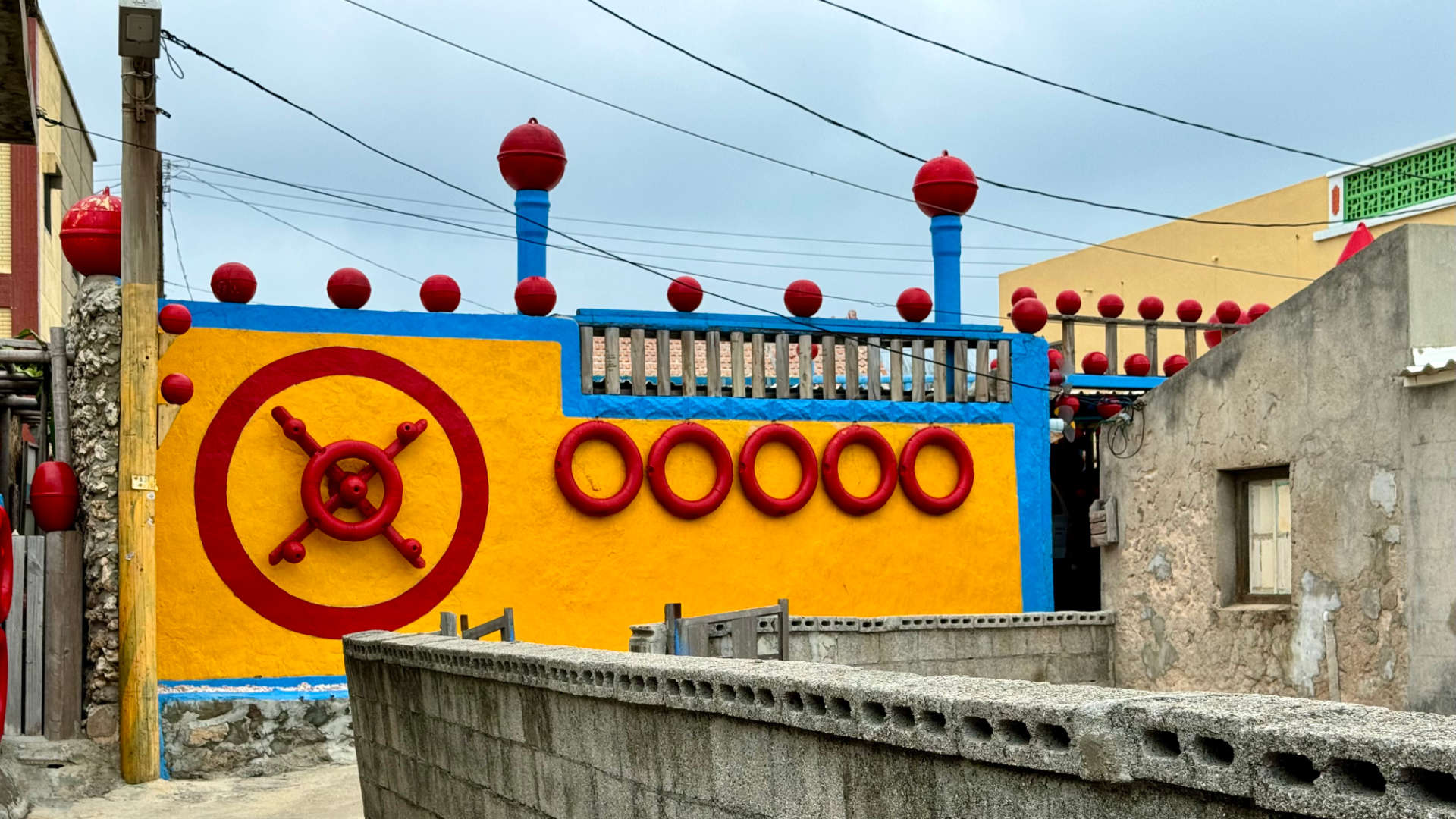 House brightly decorated like a yellow submarine.