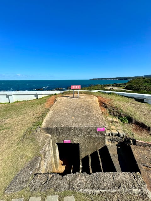 A concete bunker-style underground pillbox, at the top of the cliffs.