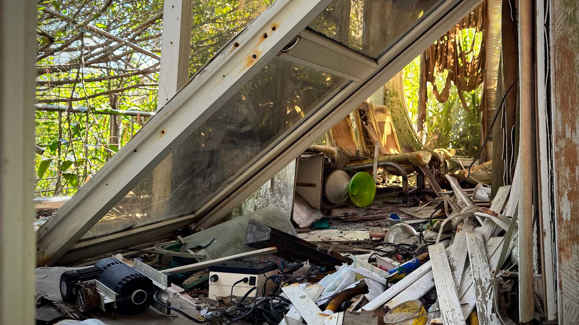 A thoroughly-trashed interior of a building.