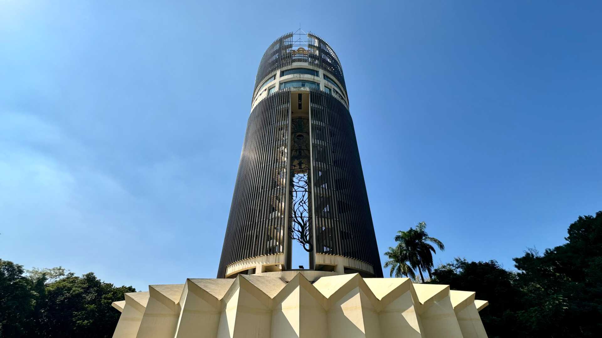 Sun-Shooting Tower in Chiayi. The tower is cylindrical in shape, 12 stories tall, with a sunburst-shaped concrete base.