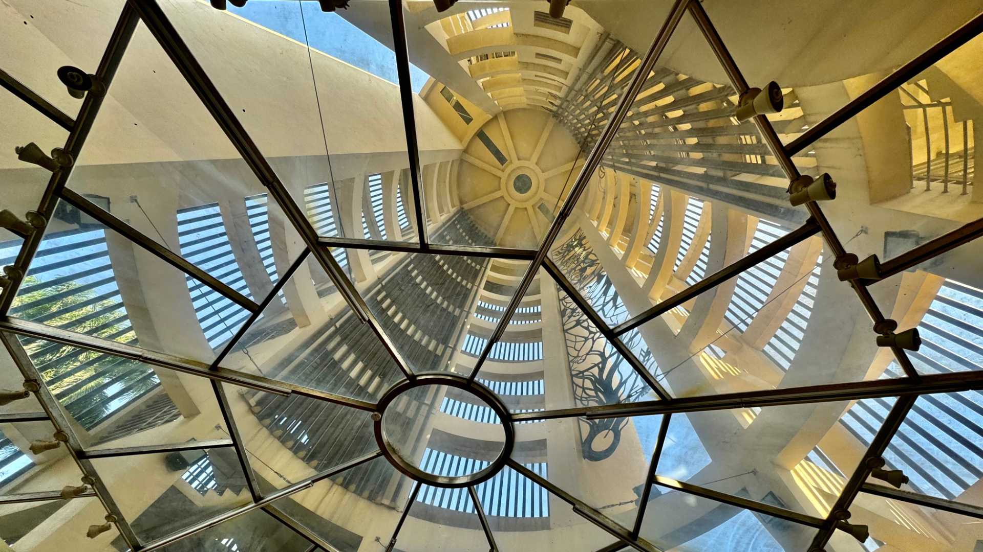 Internal view of Sun-Shooting Tower in Chiayi Park, looking up from the first floor through the hollow core to the top of the building, approximately 10 stories higher.