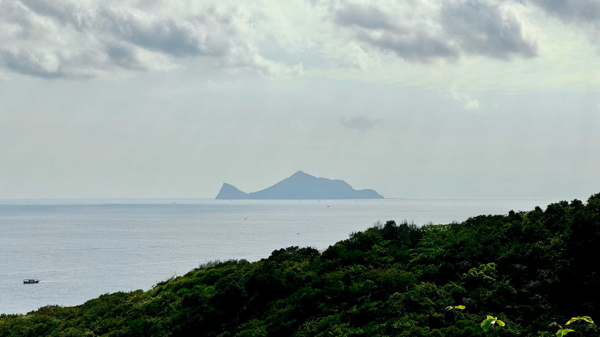 View of Turtle Island, off the coast of Taiwan. The silhouette of the island looks roughly like the shape of a turtle.
