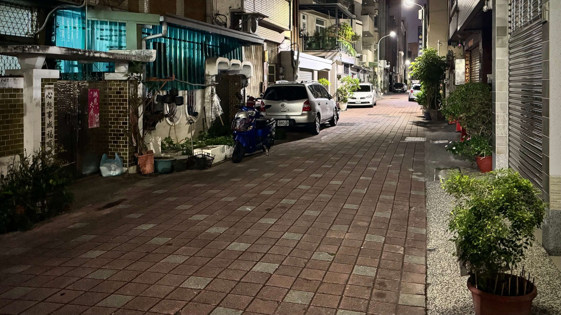 A narrow Tainan street at night.