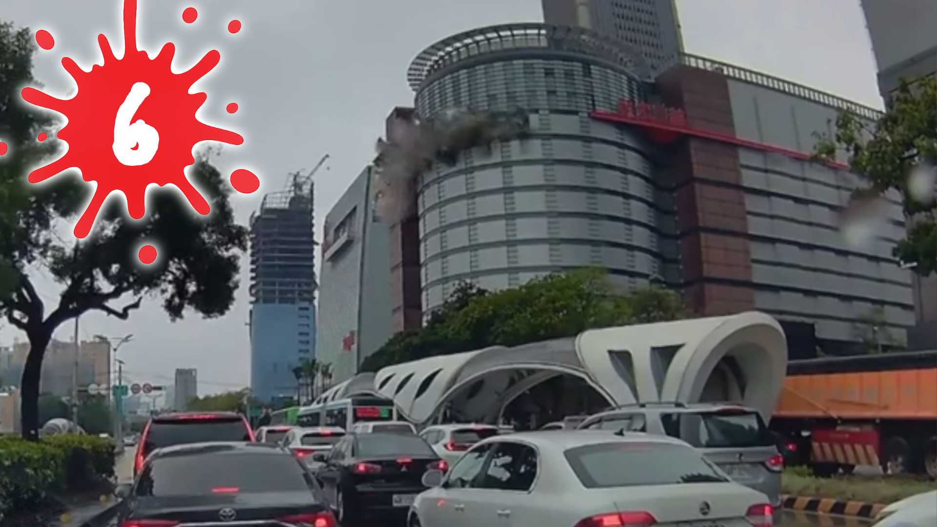 Photo of a gas explosion happening in a Taichung shopping mall, with the number 6 superimposed on top.