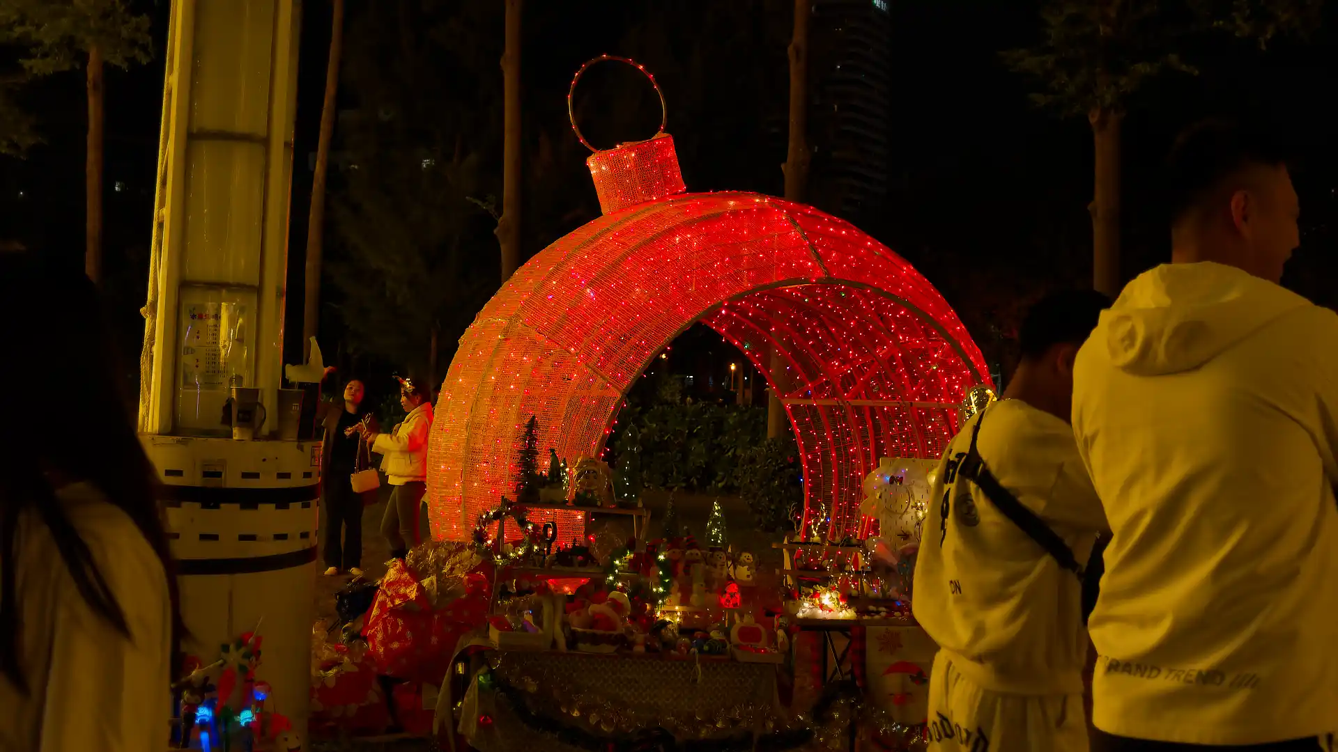 A giant illuminated Christmas ornament, perhaps three meters high.