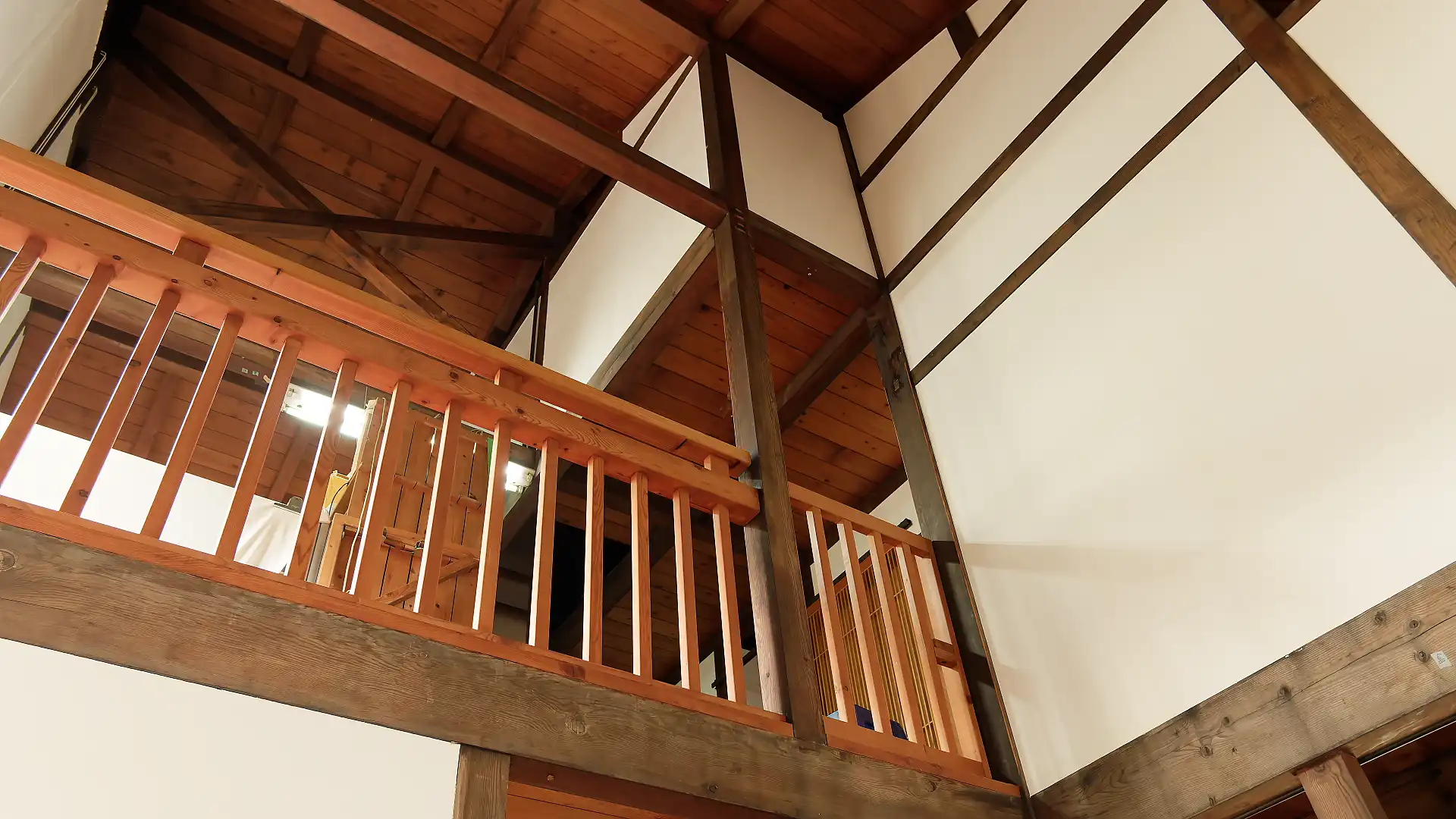 Interior view looking up towards the second floor of A Book Wooden House’.