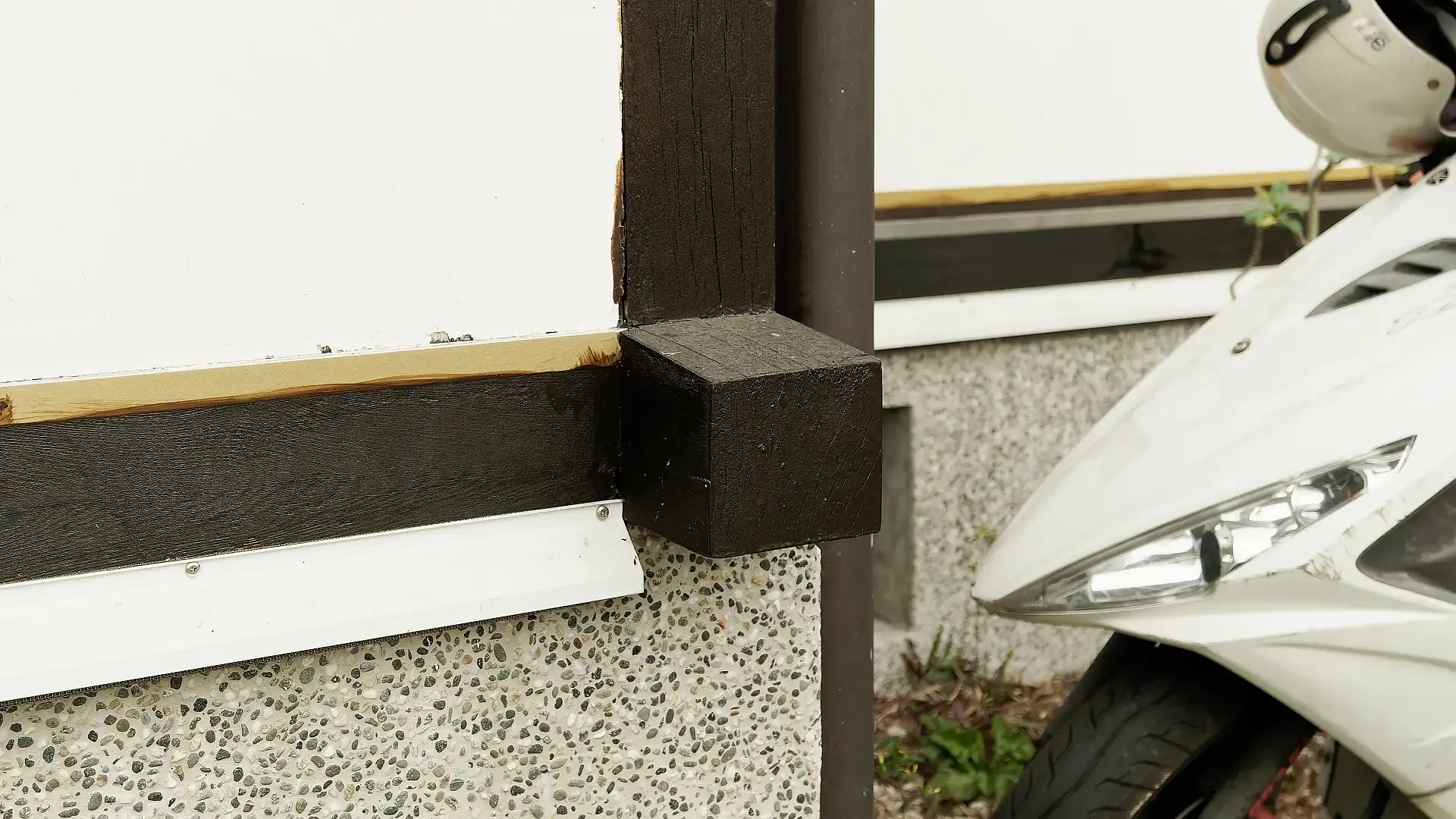 Close-up photo of wooden joints on the exterior wall of ‘A Book Wooden House’.