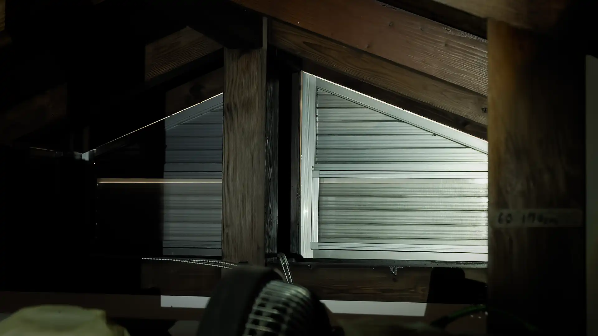 Metal mechanical shutters in the attic.