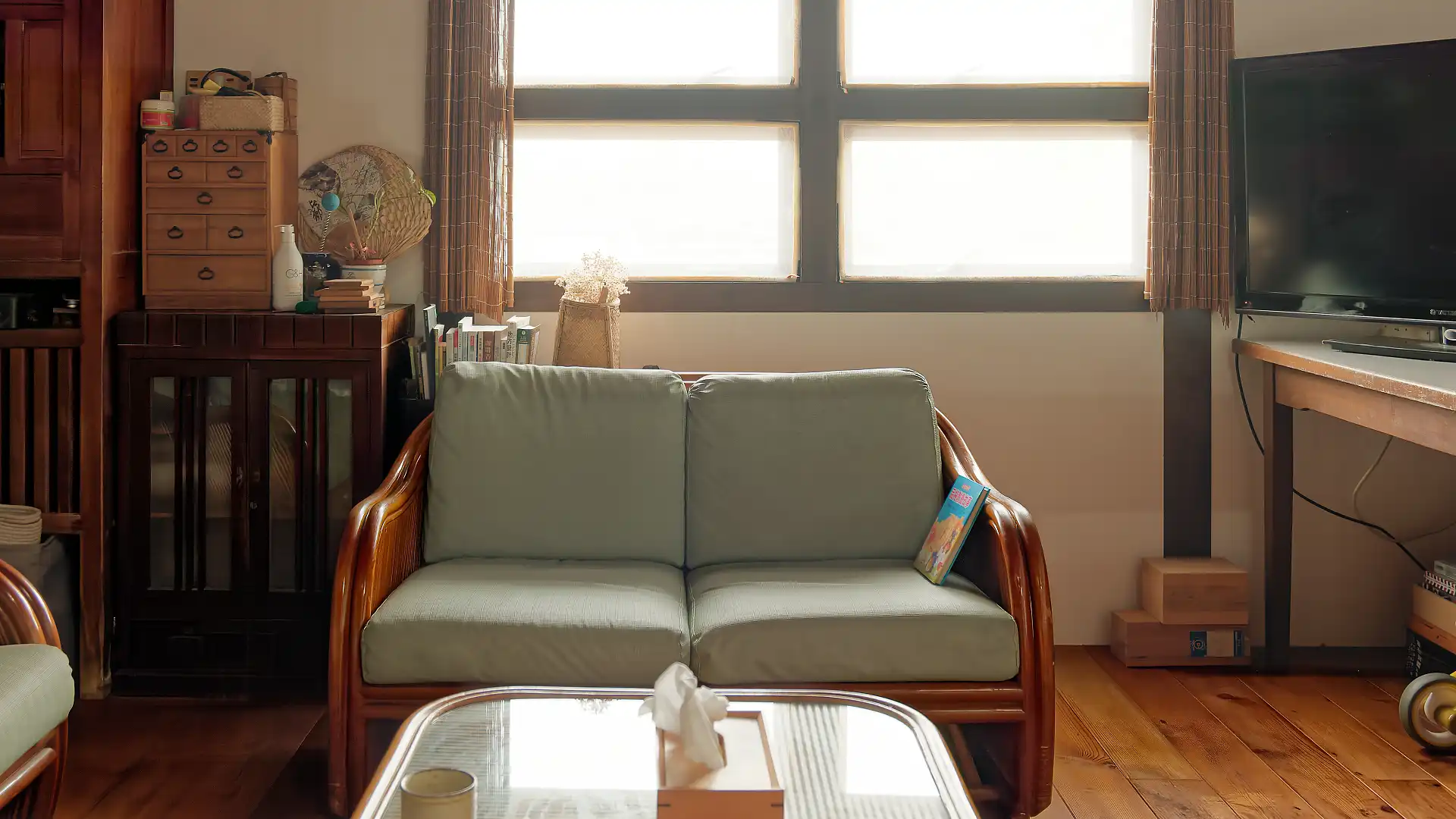 A wooden sofa in a living room.
