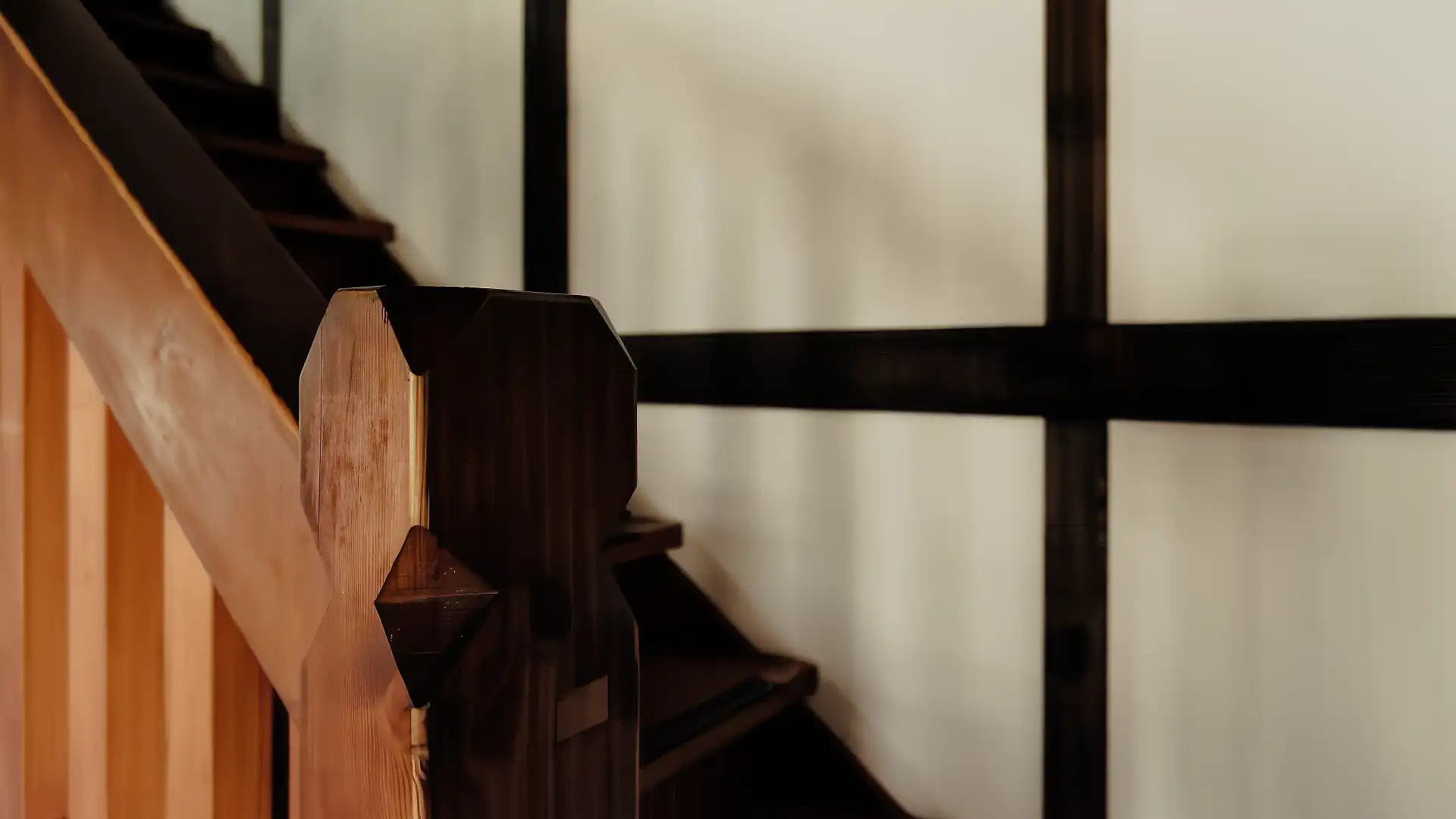 Close-up of the wood detailing on a wooden staircase.
