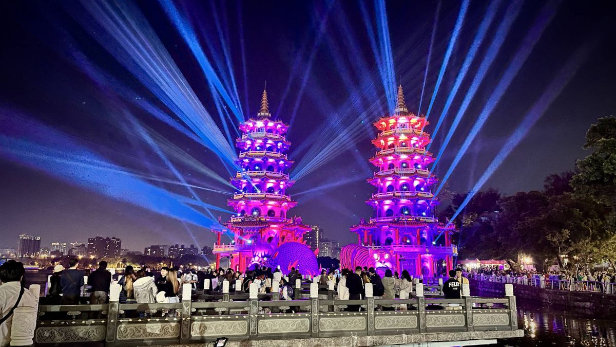 The Dragon and Tiger Pagodas at Lotus Pond, Kaohsiung, illuminated in pink.