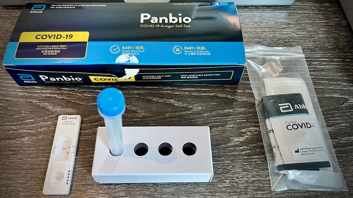 A ‘Panbio’ COVID-19 Antigen Self-Test kit, showing a negative result on the test device, plus other kit contents.
