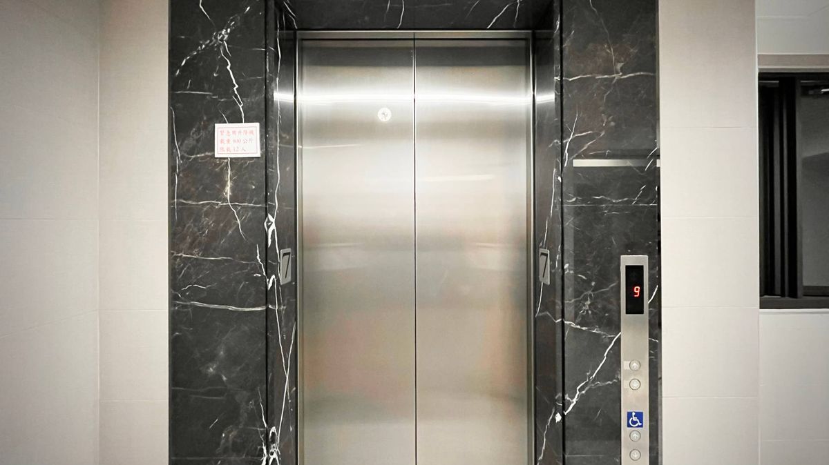 The outside of a generic elevator, with doors closed.