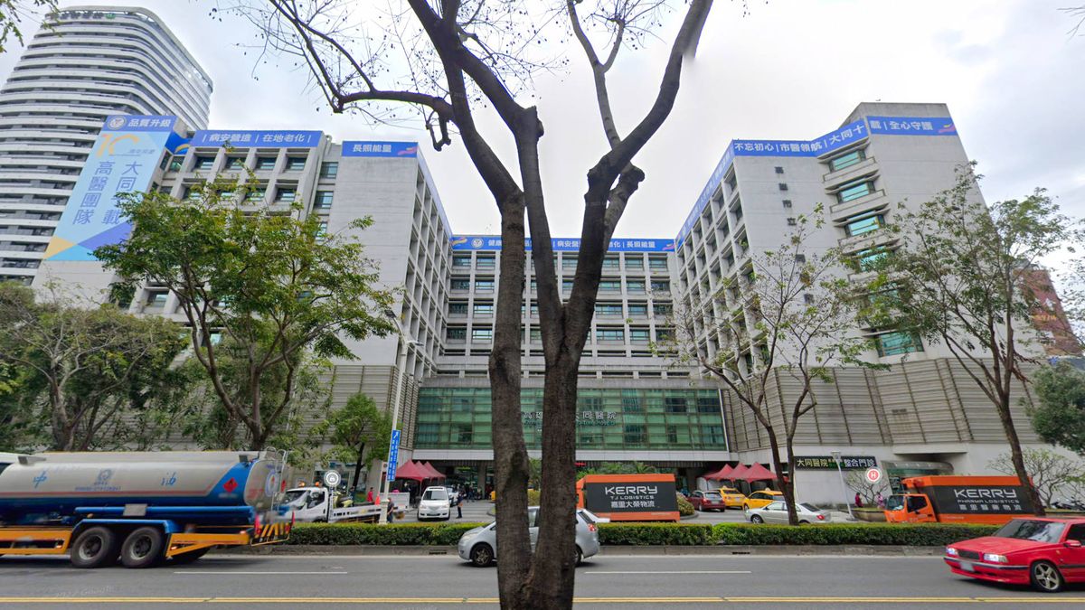 Google Maps photo of a large hospital building on a busy multi-lane road.